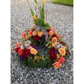 Krans med blomster opsats